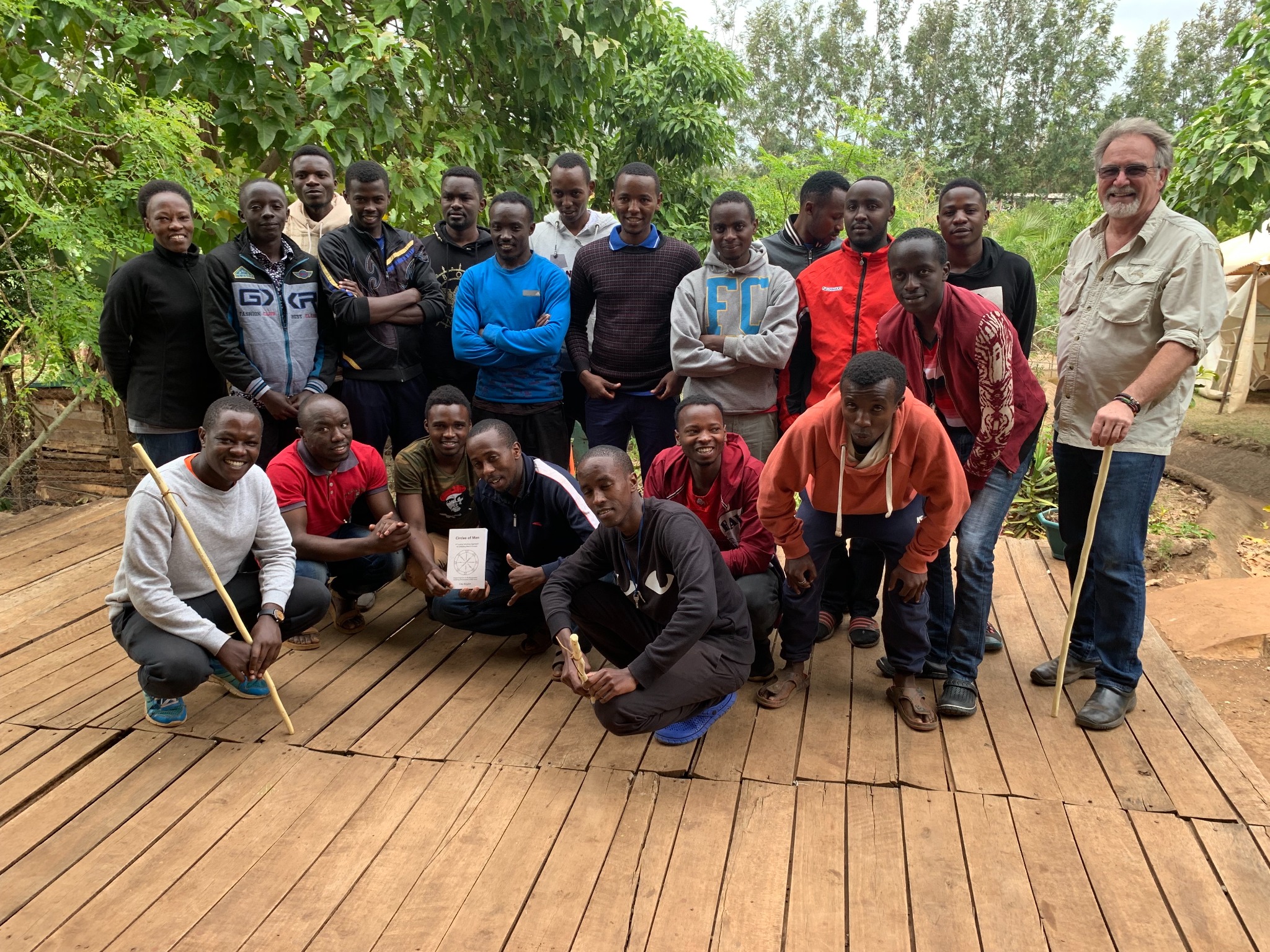 Clay Boykin standing with participants in a men's retreat in Kenya